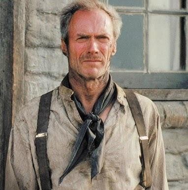 Clint Eastwood reżyserujący film na planie, ukazany w dynamicznej, autorytarnej pozie.